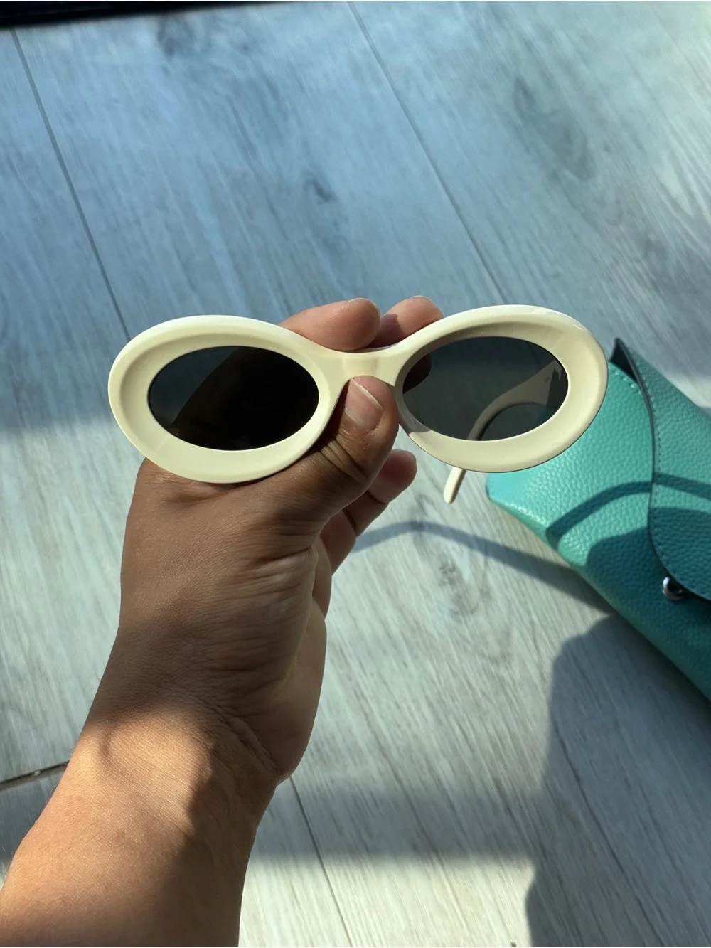 Loewe Ivory Oval Sunglasses with Dark Lenses